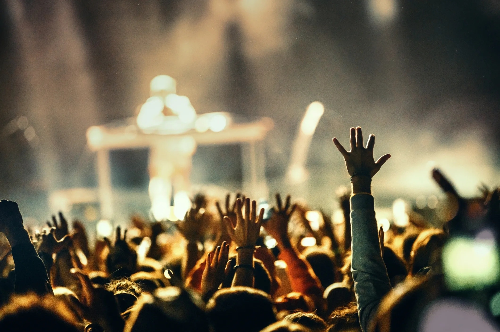 A live concert event with a crowd and stage lights