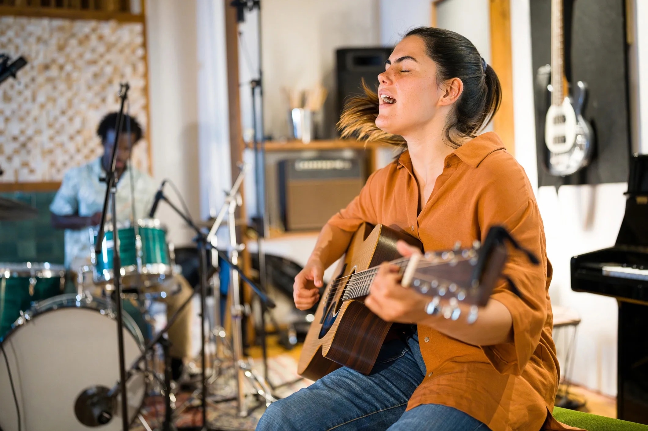 An independent musician performing an acoustic session