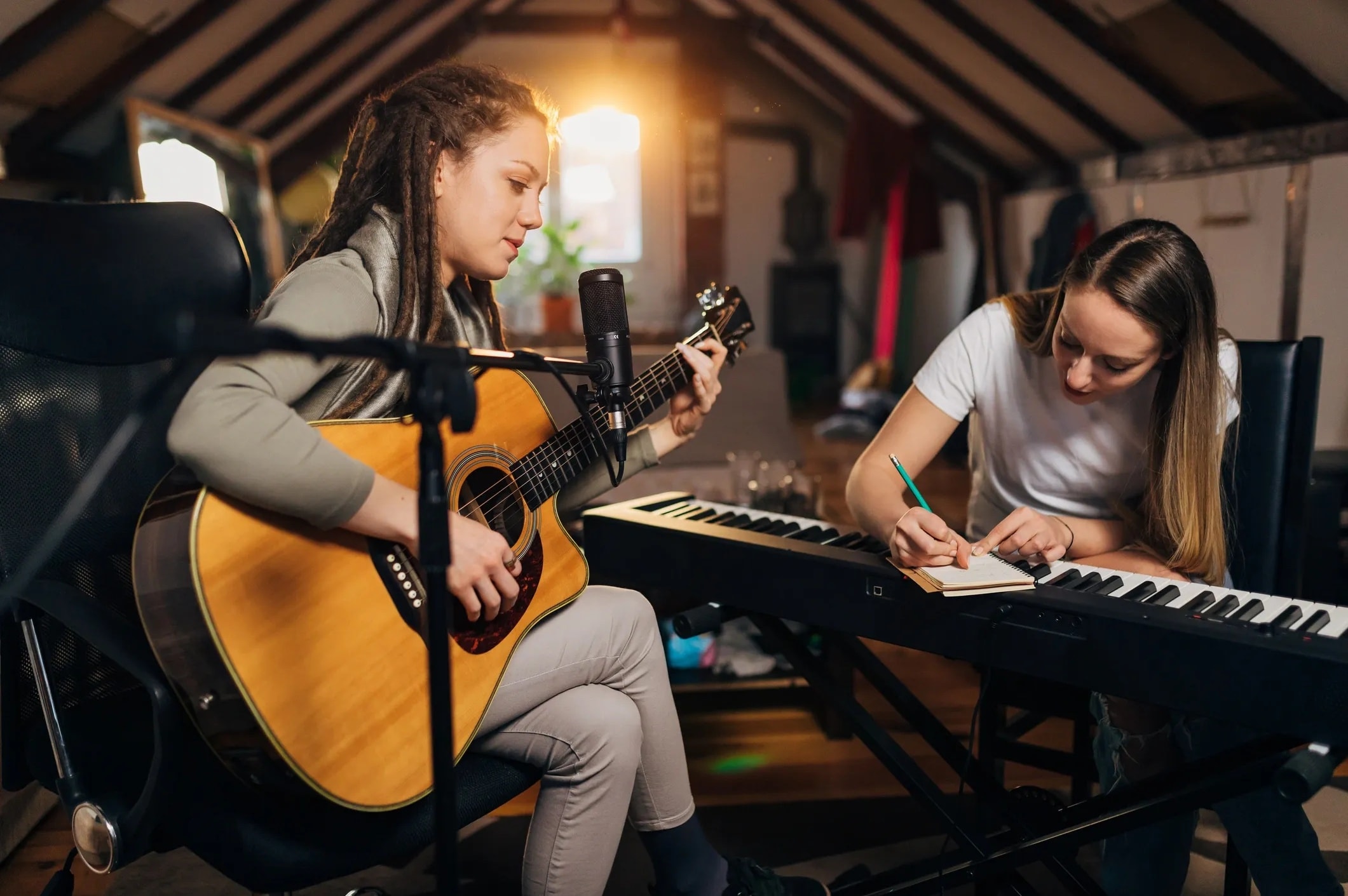 Two musicians recording guitar and keyboard together — independent artists creating music on MAOZ